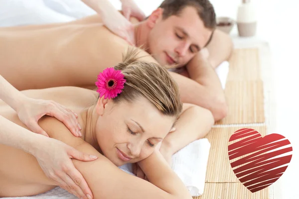 Samengestelde afbeelding van ontspannende paar met een massage — Stockfoto