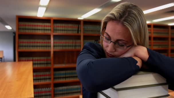 Librarian sleeping on her books — Stock Video