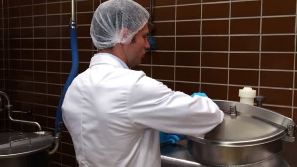 Brewery worker checking the product — Stock Video