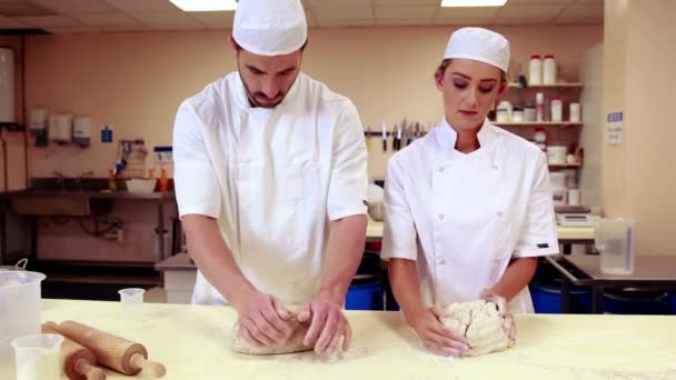 Culinary students kneading dough together — Stock Video