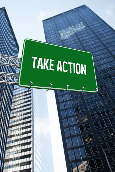 Take action against low angle view of skyscrapers — Stock Photo, Image