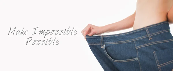 Woman belly in too big pants — Stock Photo, Image