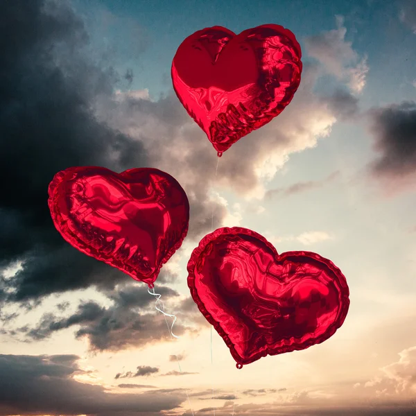 Composite image of love heart balloons — Stock Photo, Image