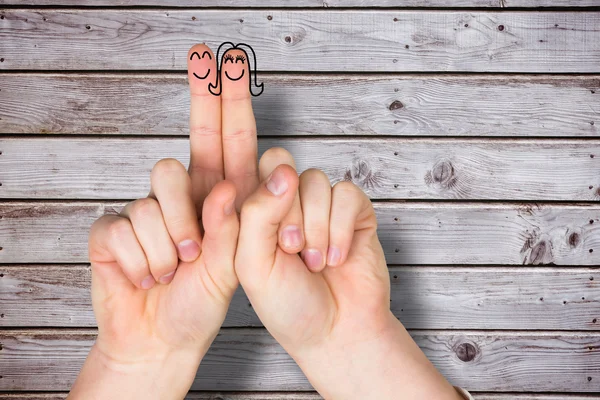 Imagen compuesta de dedos cruzados como una pareja — Foto de Stock