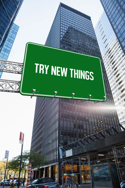 Try new things against skyscraper in city — Stock Photo, Image