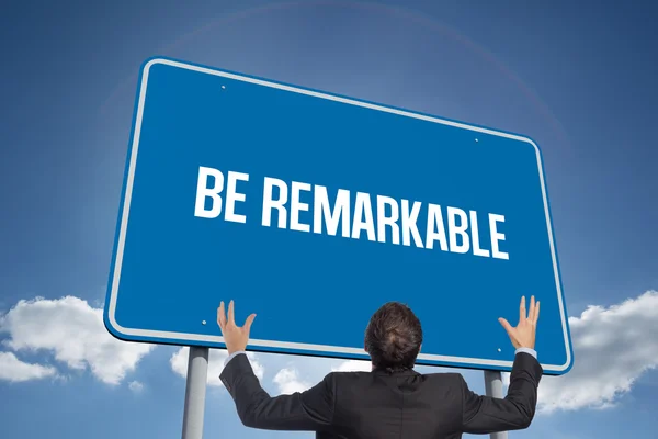 Word be remarkable and gesturing businessman — Stock Photo, Image
