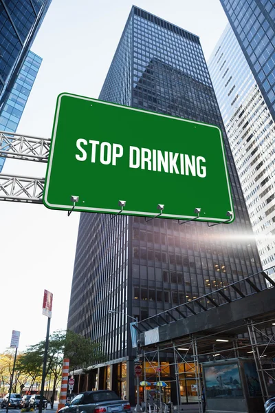 Stop drinking against skyscraper in city — Stock Photo, Image