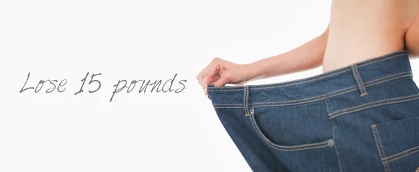 Woman belly in too big pants — Stock Photo, Image