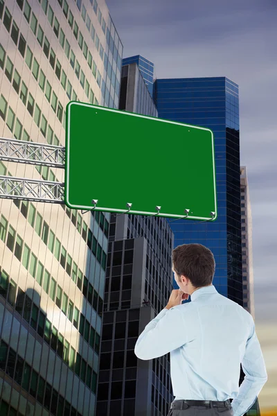 Thoughtful businessman with hand on chin — Stock Photo, Image