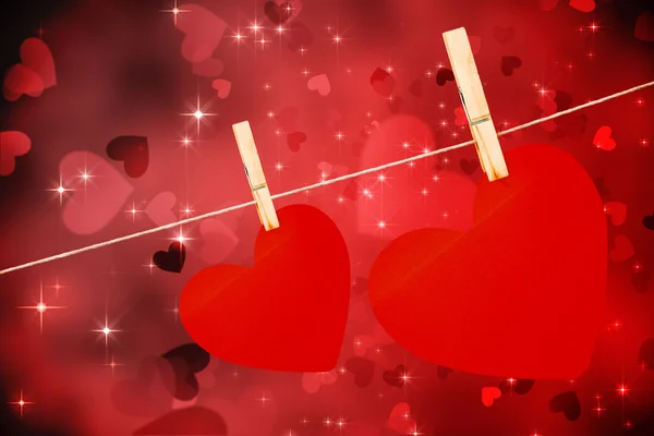 Composite image of hearts hanging on a line — Stock Photo, Image