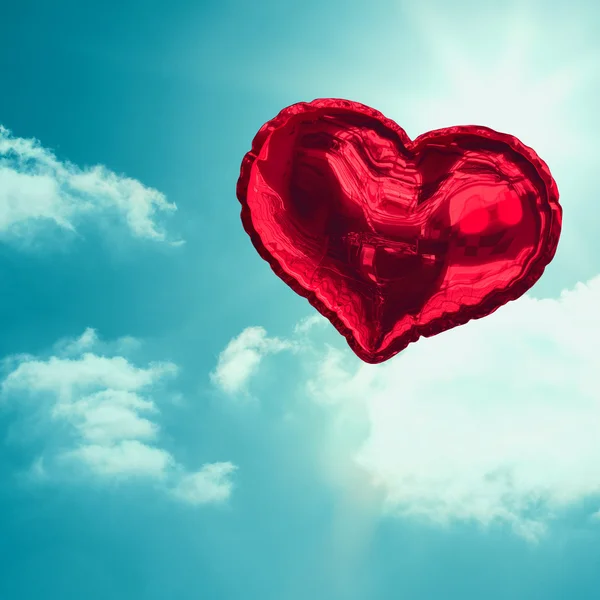 Composite image of red heart balloon — Stock Photo, Image