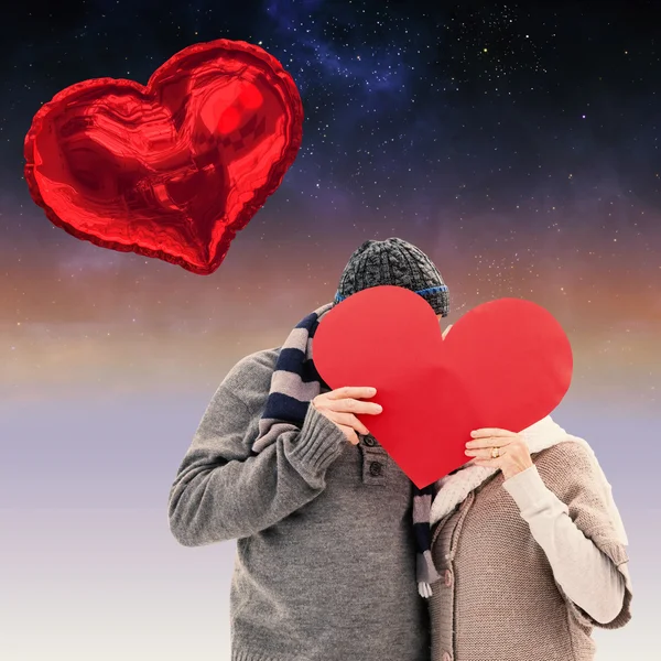 Happy mature couple in winter clothes holding — Stock Photo, Image