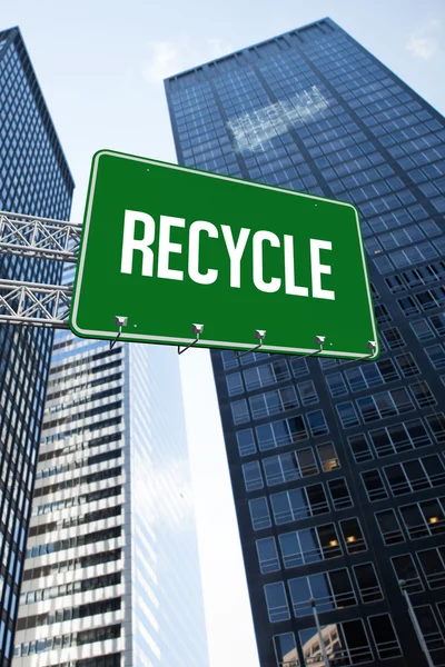 Recycle against low angle view of skyscrapers — Stock Photo, Image