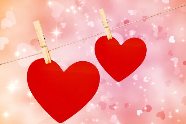 Composite image of hearts hanging on a line — Stock Photo, Image