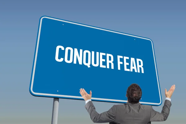 Word conquer fear and businessman — Stock Photo, Image