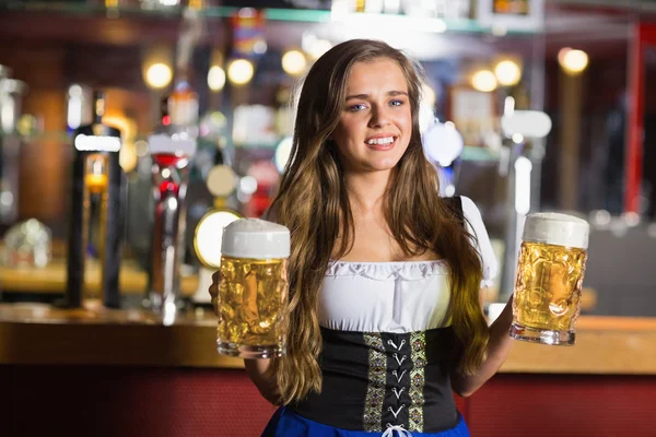 Smiling oktoberfest barmaid with beer — Stock Photo, Image