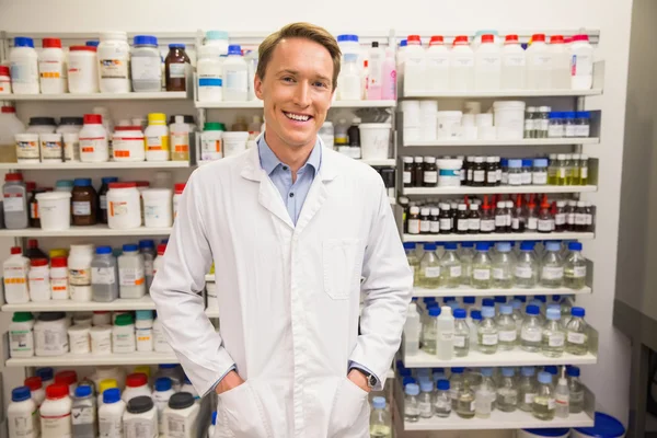 Handsome pharmacist smiling at camera — Stock Photo, Image