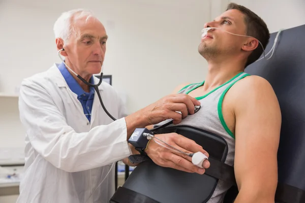 Man strapped to gurney to find out his BMR — Stock Photo, Image