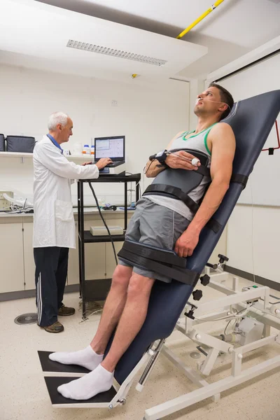 Man strapped to gurney to find out his BMR — Stock Photo, Image