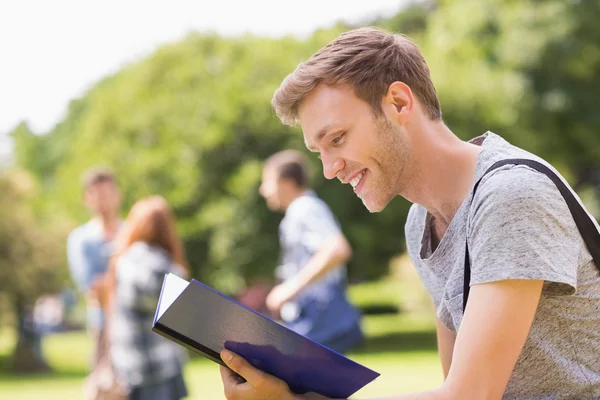 Handsome student studying outside on campus — Stock Photo, Image