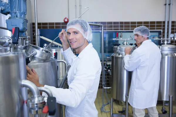 Scientist working and smiling at camera — Stock Photo, Image