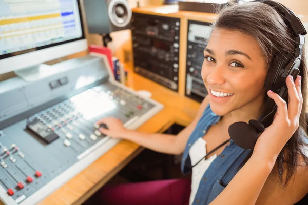 Smiling university student mixing audio — Stock Photo, Image