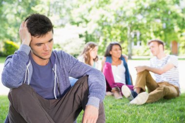 Lonely student feeling excluded on campus clipart