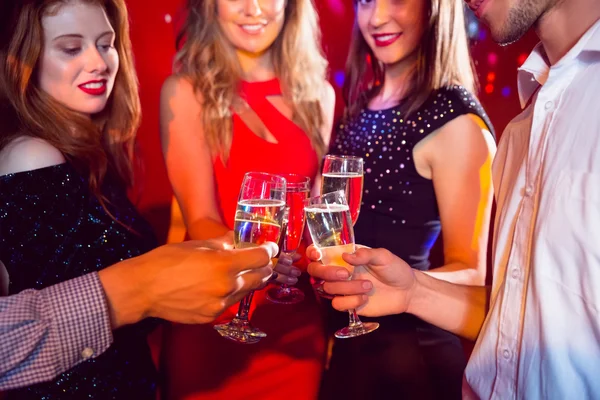 Happy friends on a night out together — Stock Photo, Image