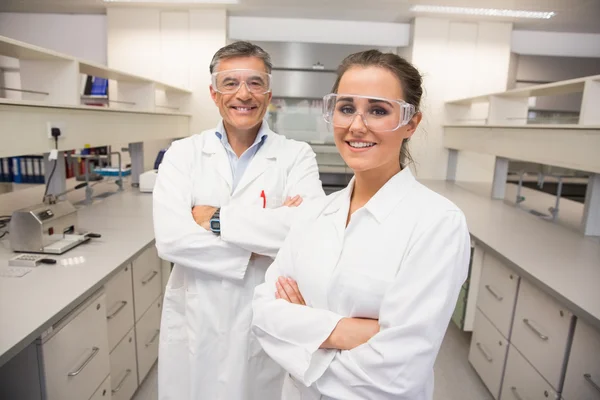 Team of pharmacists smiling at camera — Stock Photo, Image