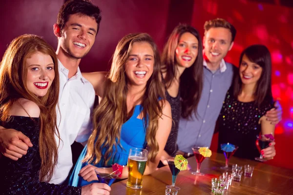 Happy friends on a night out together — Stock Photo, Image