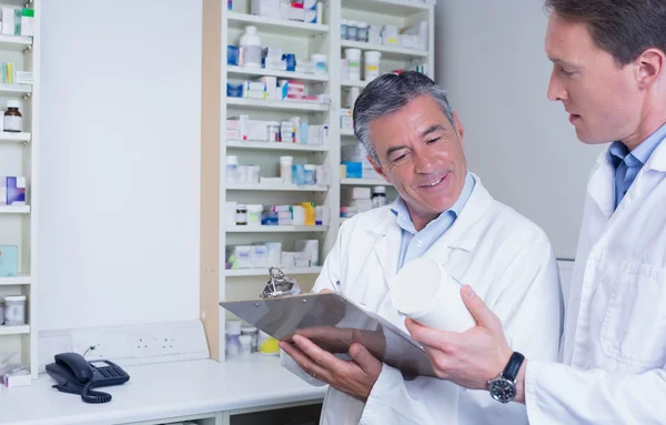 Pharmacists holding medication — Stock Photo, Image