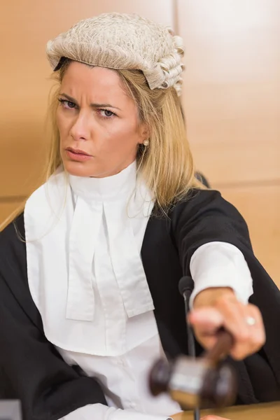 Stern judge pointing her hammer — Stock Photo, Image