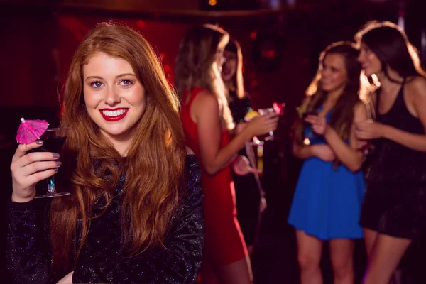 Pretty redhead drinking a cocktail — Stock Photo, Image