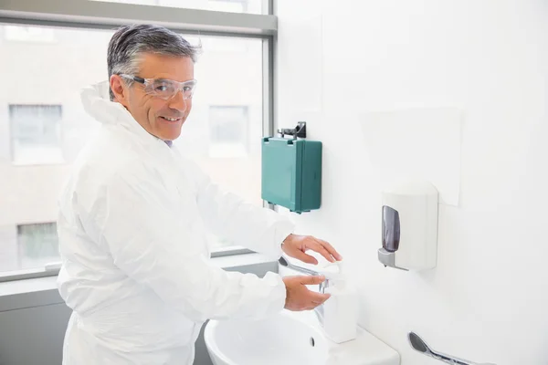 Pharmacist washing his hands at sink — Stock Photo, Image