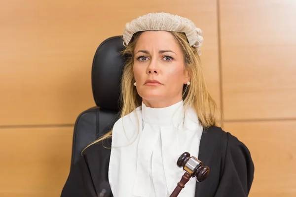 Stern judge sitting and listening — Stock Photo, Image