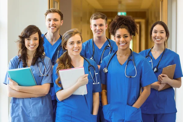 Medical students smiling at the camera — Stock Photo, Image