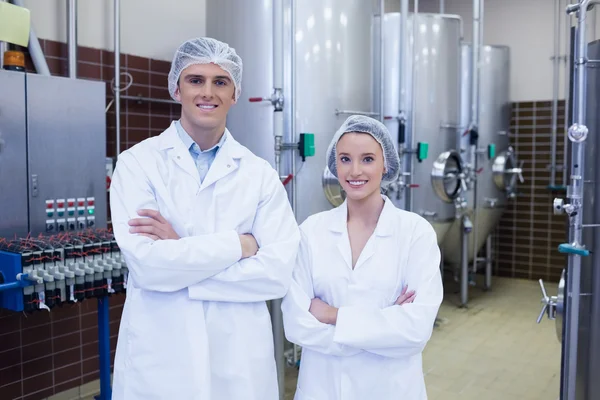 Happy scientists posing with arms crossed — Stock Photo, Image