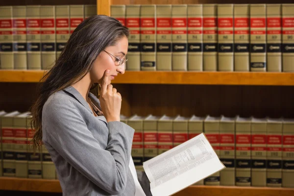 Lawyer reading in the law library — Stock Photo, Image