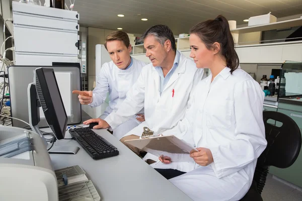 Team of scientists working together — Stock Photo, Image