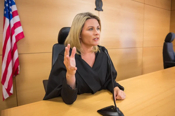 Stern judge speaking to the court — Stock Photo, Image