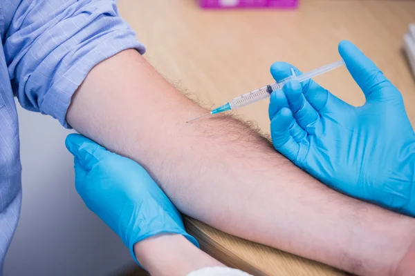 Close up of a patient receiving injection — Stock Photo, Image