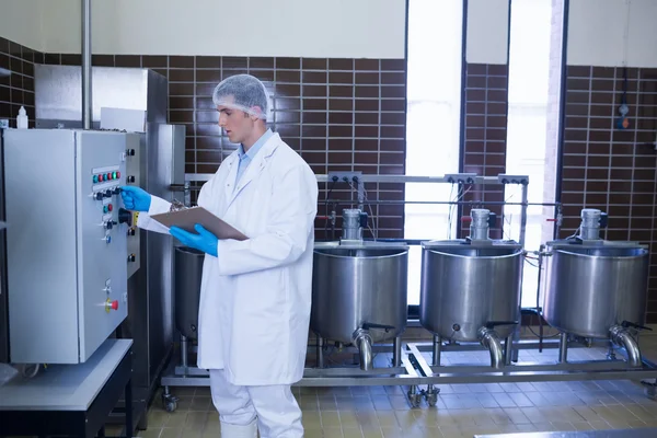 Focused biologist using the machine — Stock Photo, Image