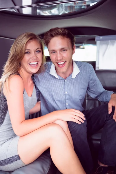 Happy couple smiling in limousine — Stock Photo, Image