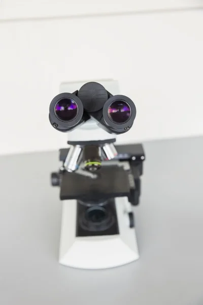 Microscope on a desk — Stock Photo, Image