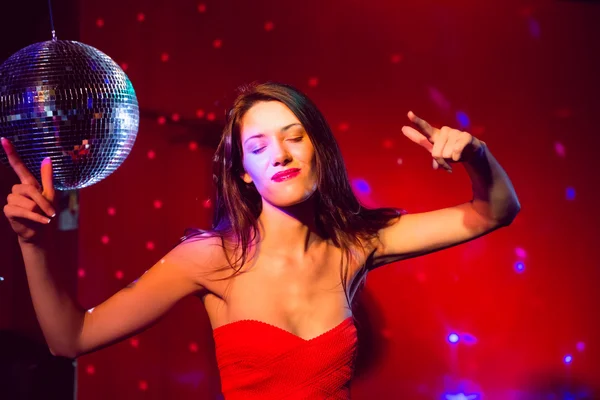 Pretty brunette dancing and smiling — Stock Photo, Image