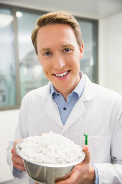 Pharmacist showing bowl of pills — Stock Photo, Image