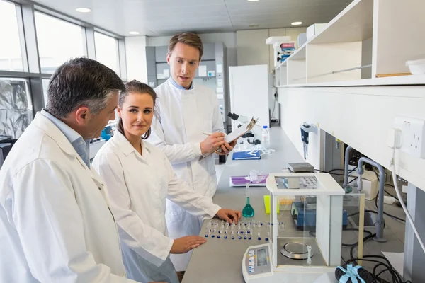 Team of scientists working together — Stock Photo, Image