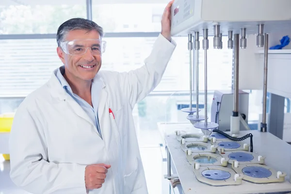 Smiling scientist with safety glasses — Stock Photo, Image