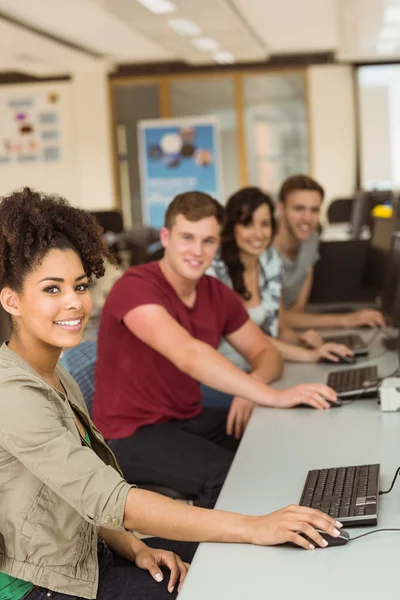 Classmates working in the computer room — Stock Photo, Image