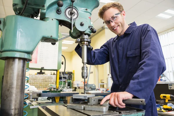 Engineering student using large drill — Stock Photo, Image